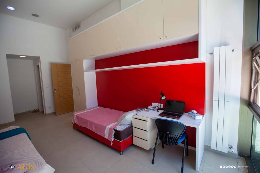 Each dormitory bedroom comes with a desk and chair, bed and mattress, and storage cupboards.